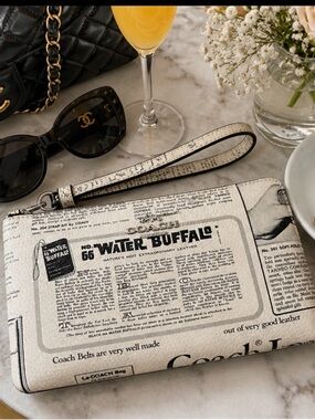 NWT | COACH Large Corner Zip Wristlet
With Newspaper Print | Water Buffalo
